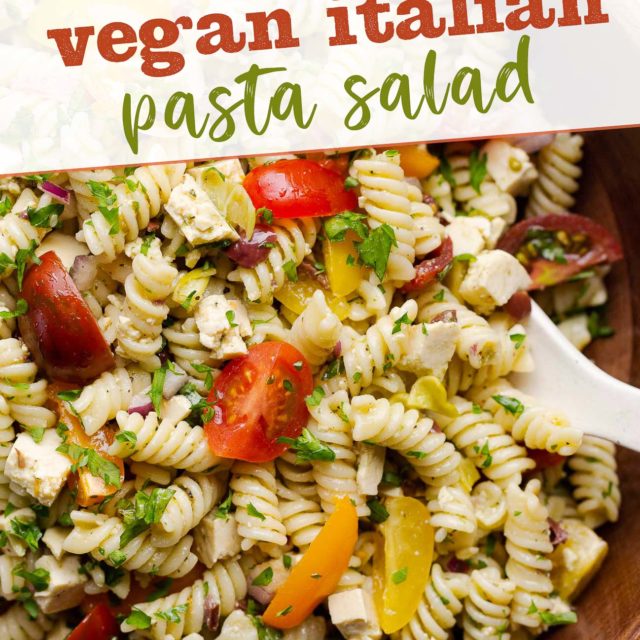 Vegan Italian pasta salad in a dark wooden bowl.